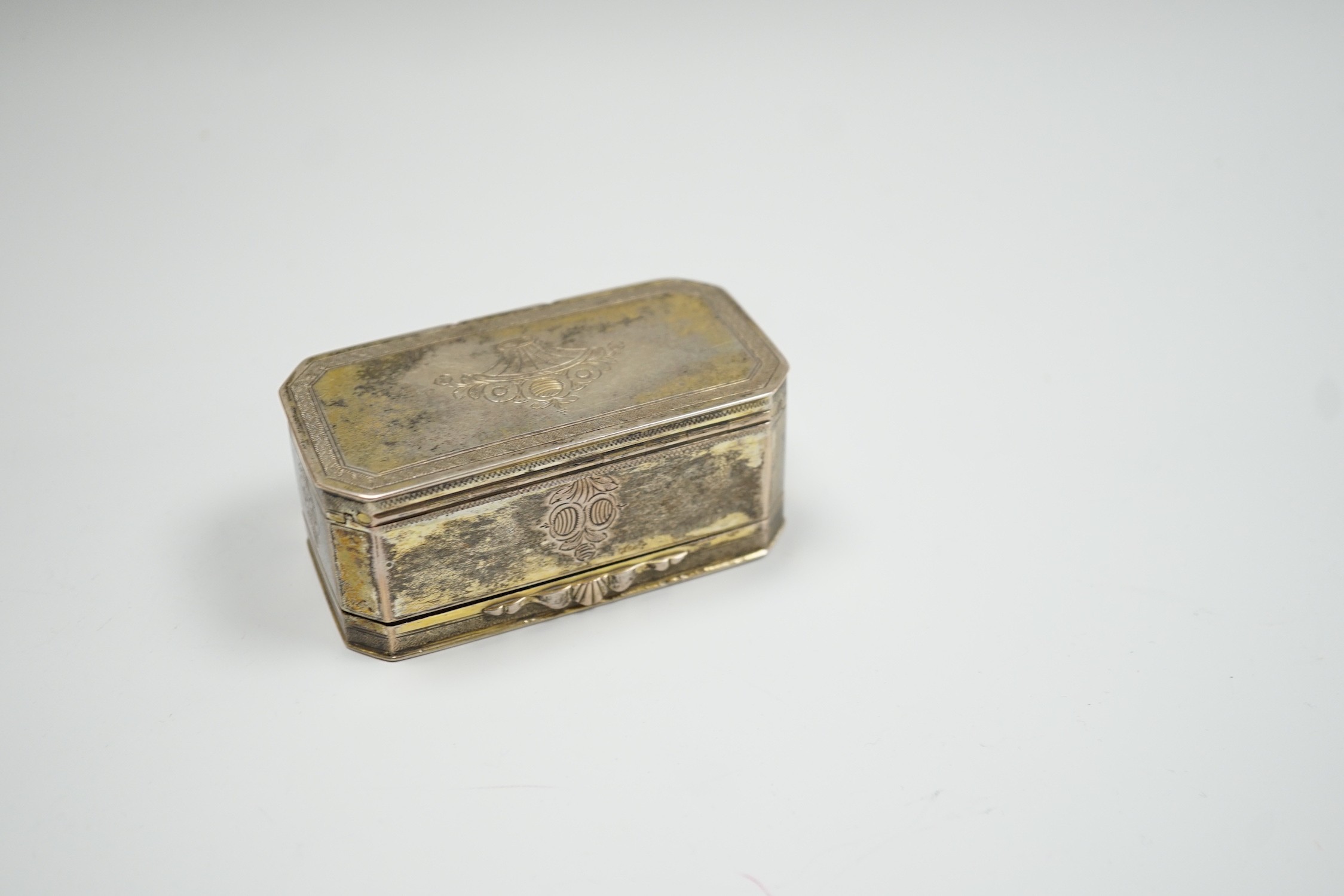 A 19th century German? engraved gilt white metal double hinged octagonal snuff box, 86mm.